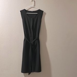 Minimalistic sleeveless black wrap dress